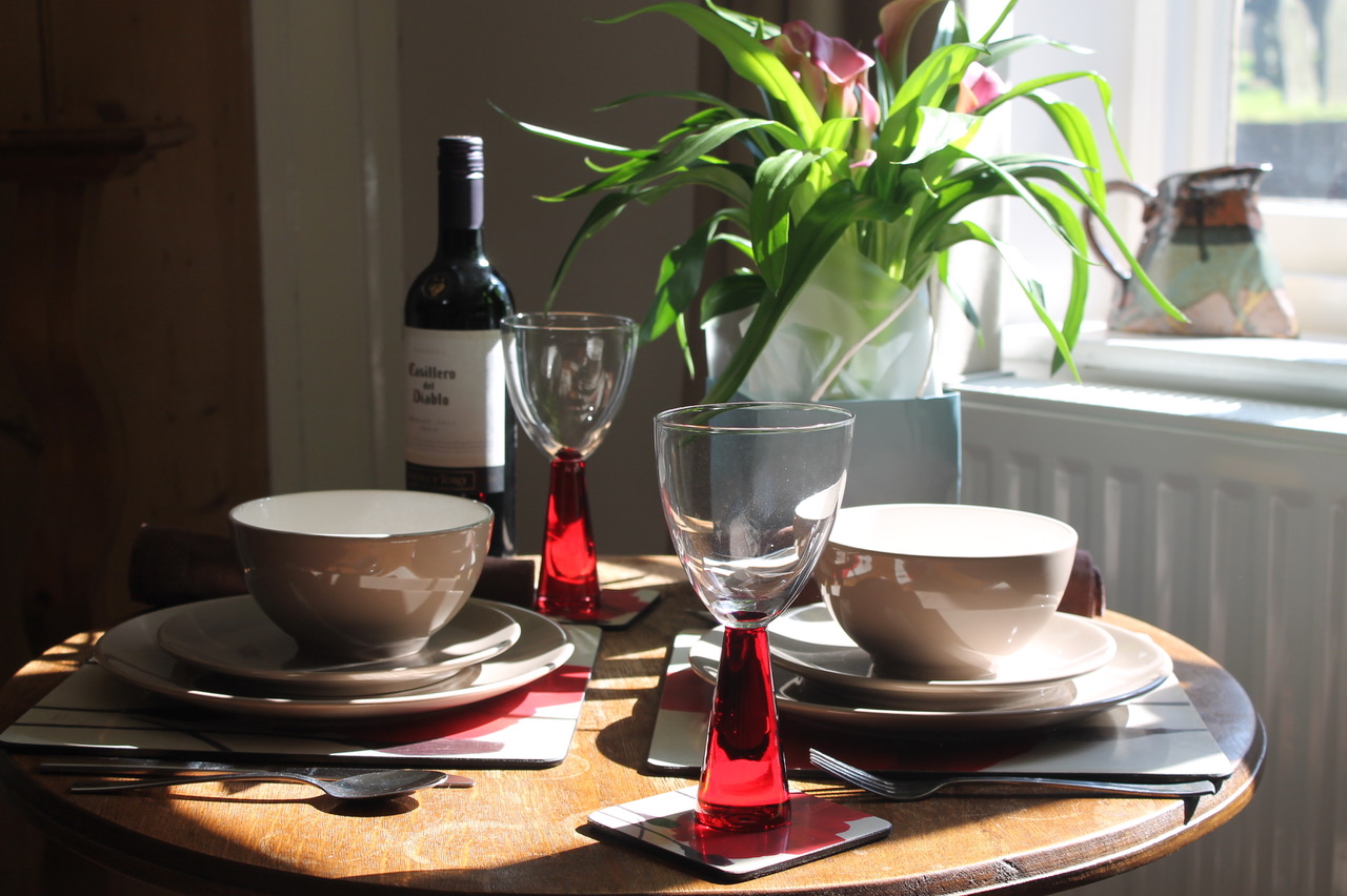 Close up photo of the kitchen table set for breakfast
